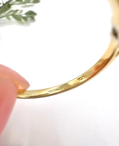 Close-up of stamps inside a yellow gold ring shank