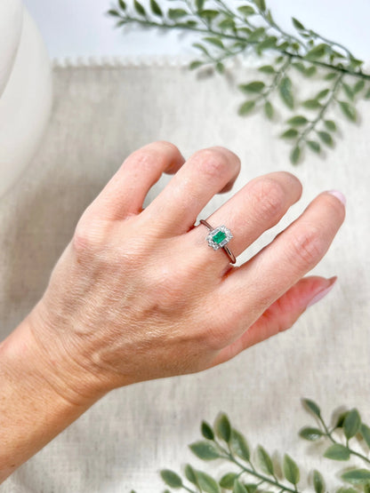 Vintage 18 Carat White Gold Emerald Cut Emerald and Diamond Cluster Ring, Circa 1940