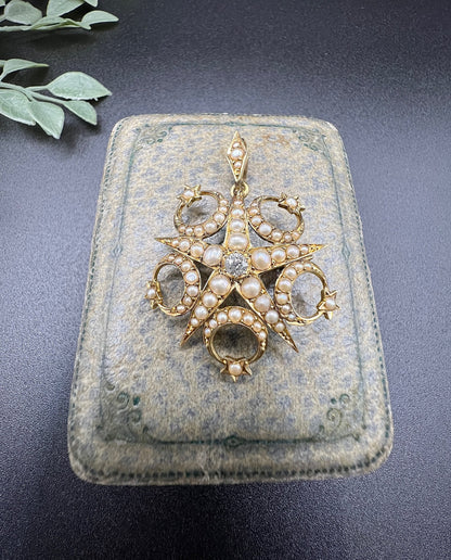 A yellow gold star and crescent brooch/pendant set with a diamond and pearls