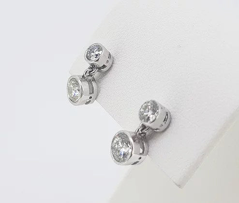 1.10ct Diamond Drop Earrings; featuring brilliant cut diamonds suspended from a diamond set stud, 1.10 carat total, in 18ct white gold
