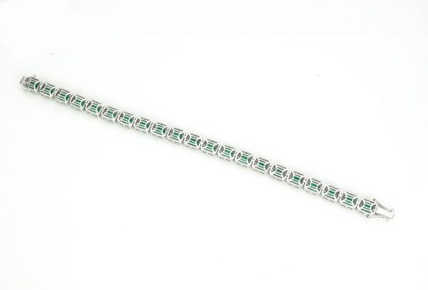 Colombian Emerald and Diamond Cluster Bracelet; featuring 9.02cts emerald-cut emeralds and 3.00cts brilliant cut diamonds, in 14ct White Gold, with certificate