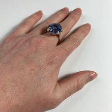 Vintage 8.90ct Sapphire and Diamond Cluster Ring; nine oval sapphires in a floral design, accented with brilliant cut diamonds, in 18ct white and rose gold