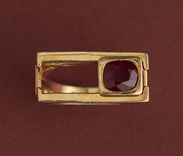 Vintage Geometric Ruby and 18ct Yellow Gold Articulated Slider Ring; cushion mixed-cut natural red ruby in gold rectangular setting slides.  France, Circa 1980-1990