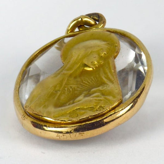Rock Crystal and 18ct Gold Madonna and Child Charm Pendant; oval faceted rock crystal in a gold frame, with an inset gold plaque depicting the Madonna and child, Signed G. Vernon and numbered 45174