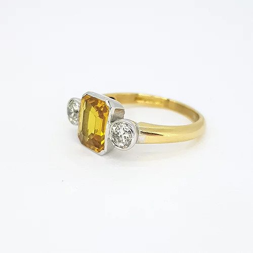 2.25ct Emerald Cut Yellow Sapphire and Diamond Three Stone Ring, on an 18ct yellow gold shank