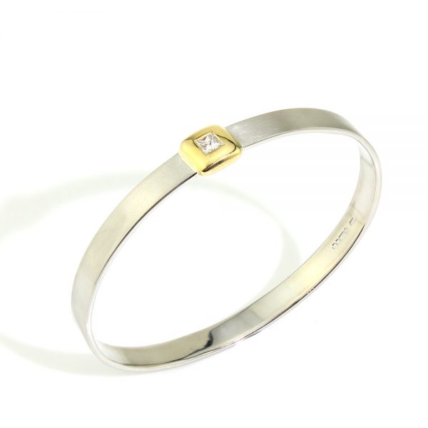 Platinum Bangle Bracelet with Princess Cut Diamond; 0.41ct F VS1 princess-cut diamond in 18ct yellow gold square setting mounted to a platinum bangle, Circa 2000