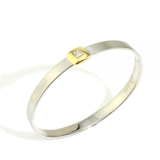 Platinum Bangle Bracelet with Princess Cut Diamond; 0.41ct F VS1 princess-cut diamond in 18ct yellow gold square setting mounted to a platinum bangle, Circa 2000