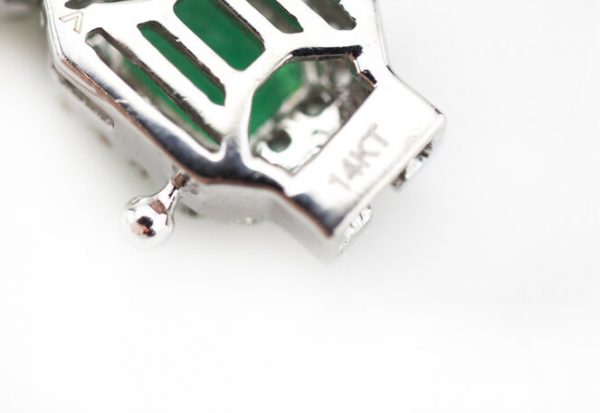 Colombian Emerald and Diamond Cluster Bracelet; featuring 9.02cts emerald-cut emeralds and 3.00cts brilliant cut diamonds, in 14ct White Gold, with certificate