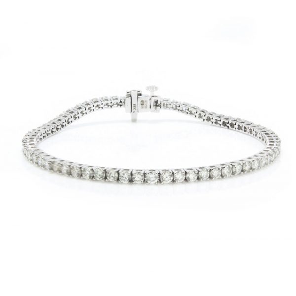 Diamond Line Tennis Bracelet in 18ct White Gold, claw set with 4.64 carats of VS1 F/G colour diamonds. Made in Birmingham, Maker AE