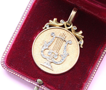 Art Nouveau Rose Cut Diamond Gold Lyre Locket Pendant; decorated with a lyre in rose cut diamonds, in original case. American, Circa 1900
