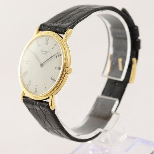 Patek Philippe 3520D Calatrava 18ct Yellow Gold 32mm Manual Watch, caliber 175, white dial, Roman numerals, sapphire crystal, black leather strap with 18ct yellow gold buckle.