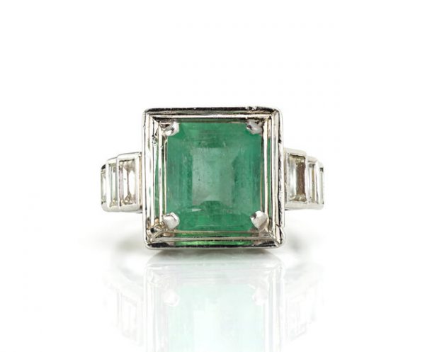 4.20ct Natural Colombian Emerald and Baguette Diamond Ring; natural 4.20 carat octagonal-cut Colombian emerald flanked by 0.70cts baguette cut diamond set shoulders, with GCS Certificate