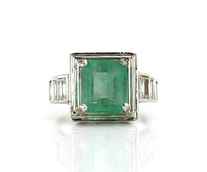 4.20ct Natural Colombian Emerald and Baguette Diamond Ring; natural 4.20 carat octagonal-cut Colombian emerald flanked by 0.70cts baguette cut diamond set shoulders, with GCS Certificate