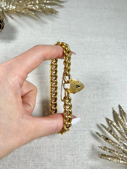 Victorian 15 Carat Yellow Gold Curb Link Bracelet with Heart Padlock Clasp, Circa 1880