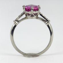 Pink Sapphire, Diamond and Platinum Solitaire Ring; set with a 1.45ct round faceted pink sapphire, with single-cut diamond set shoulders