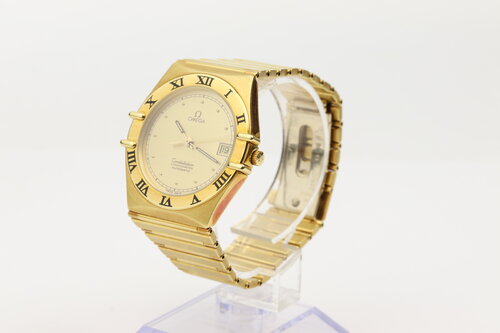 Omega Constellation 18ct Yellow Gold 35mm Chronometer Automatic, gold colour dial, date indicator, yellow gold fixed bezel, black Roman numerals, skeleton back, 18ct yellow gold bracelet with matching 18ct push-button clasp