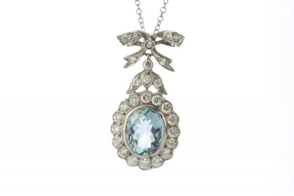 Aquamarine and Diamond Oval Cluster Pendant; featuring a 1.50ct oval faceted aquamarine surrounded by 1.00ct diamonds, in 18ct white gold