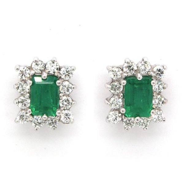 Pair of 1.28ct Emerald and 0.68ct Diamond Cluster Earrings; emerald-cut emerald set within a surround of brilliant cut diamonds, 18ct white and yellow gold.