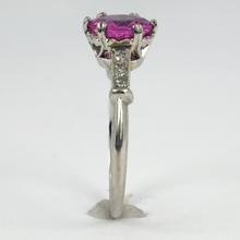 Pink Sapphire, Diamond and Platinum Solitaire Ring; set with a 1.45ct round faceted pink sapphire, with single-cut diamond set shoulders