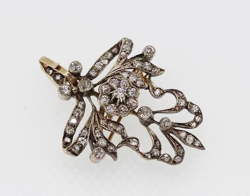 Art Nouveau Diamond set Brooch Pendant, with floral cluster, bow and swag detailing, in silver.