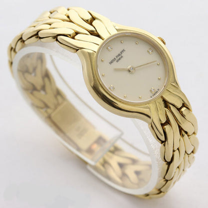 Patek Philippe La Flamme Ladies 18ct Yellow Gold 23mm Diamond Dial Quartz Watch, off-white/cream dial, four diamond hour markers, 18ct yellow gold bracelet with small fold-over clasp