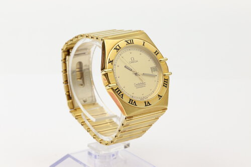 Omega Constellation 18ct Yellow Gold 35mm Chronometer Automatic, gold colour dial, date indicator, yellow gold fixed bezel, black Roman numerals, skeleton back, 18ct yellow gold bracelet with matching 18ct push-button clasp