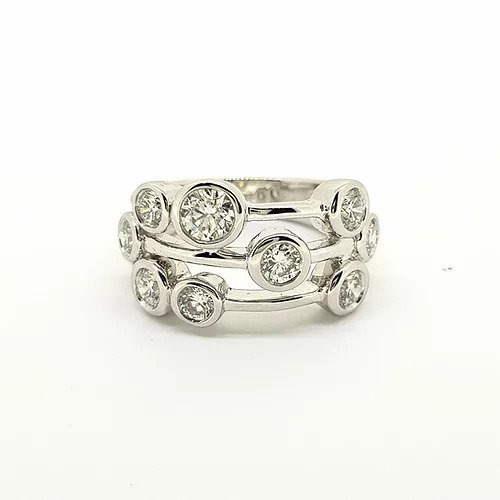 Boodle Diamond and Platinum Dress Ring; Boodle and Dunthorne 'Raindance' ring; set with nine round brilliant-cut diamonds in rubover settings, 1.50 carat total, within a pierced platinum frame