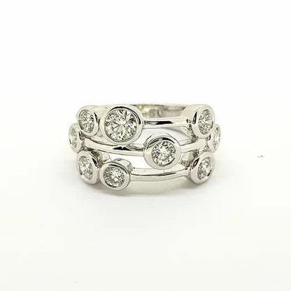 Boodle Diamond and Platinum Dress Ring; Boodle and Dunthorne 'Raindance' ring; set with nine round brilliant-cut diamonds in rubover settings, 1.50 carat total, within a pierced platinum frame