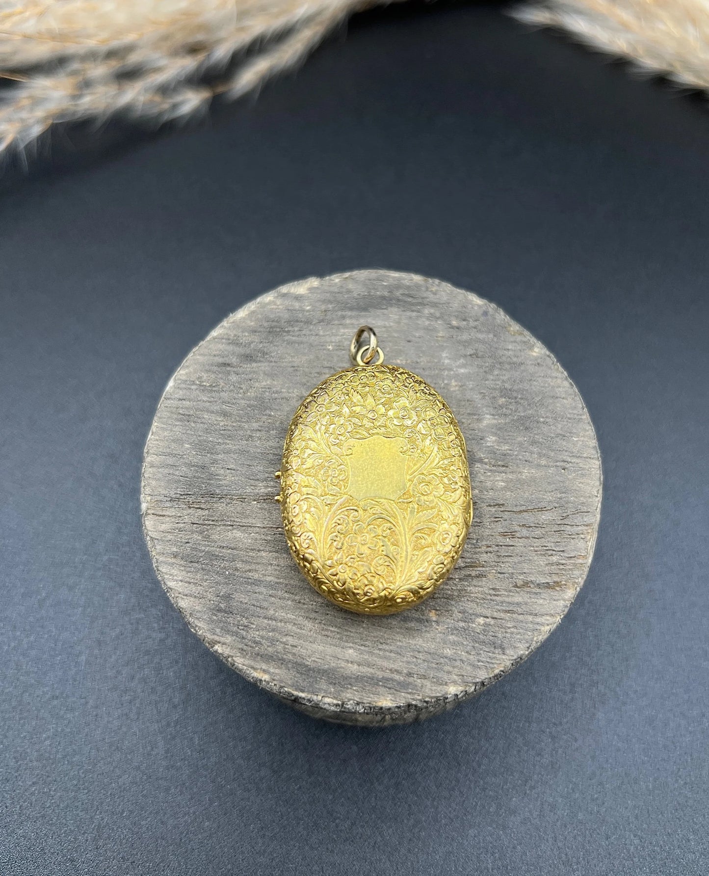 Victorian 18 Carat Yellow Gold Floral Engraved Oval Shaped Locket, Circa 1880