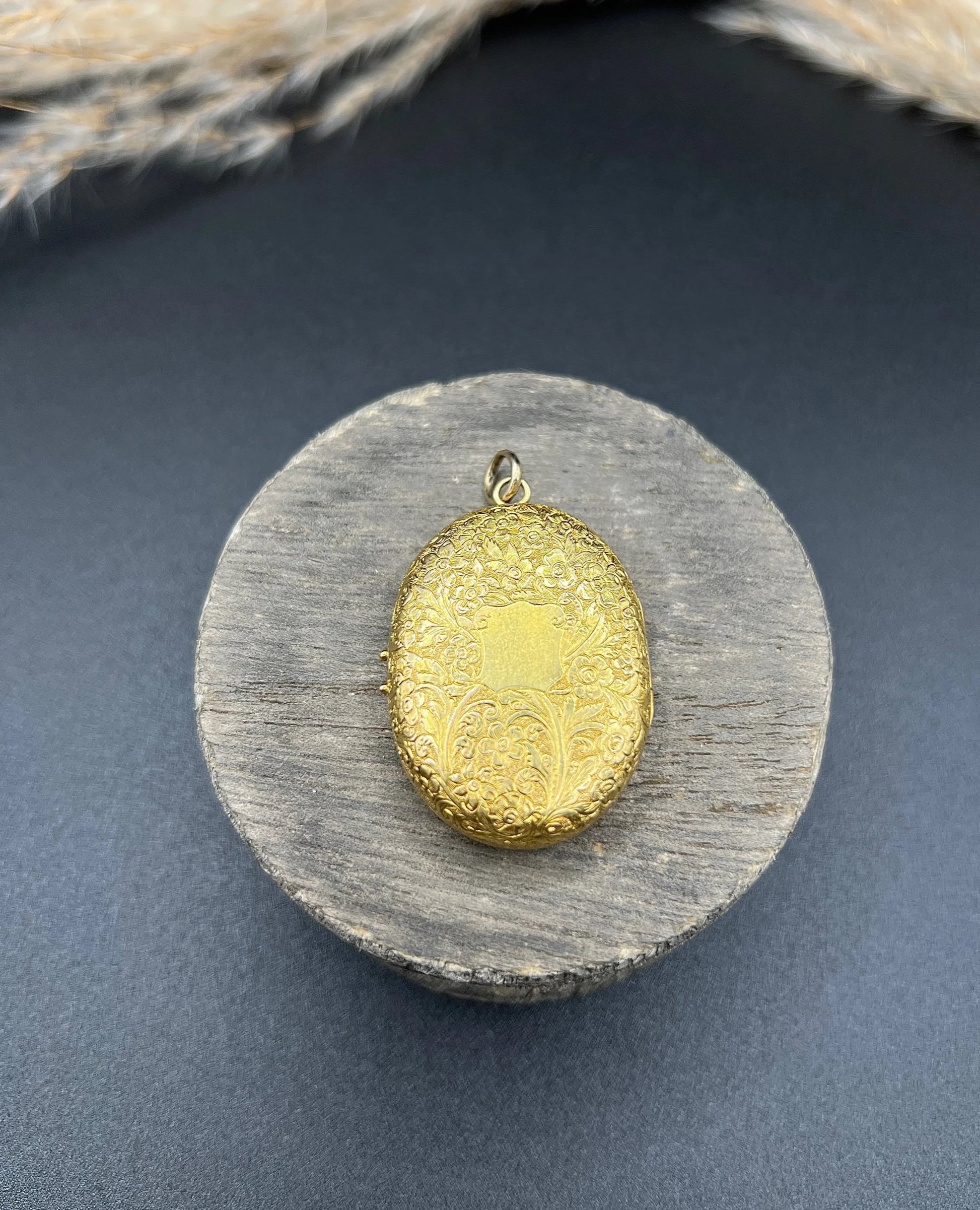 Victorian 18 Carat Yellow Gold Floral Engraved Oval Shaped Locket, Circa 1880