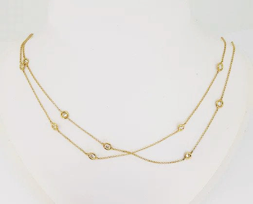 18ct Yellow Gold Diamond Set Chain; delicate 18ct yellow gold chain set with interspersed collet-set round brilliant-cut diamonds totalling 2.76 carats.