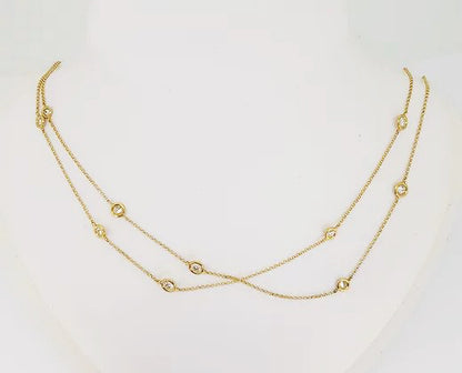 18ct Yellow Gold Diamond Set Chain; delicate 18ct yellow gold chain set with interspersed collet-set round brilliant-cut diamonds totalling 2.76 carats.