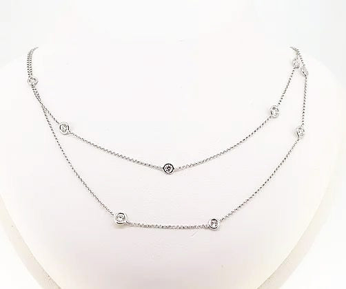 Brilliant-Cut Diamond Long Chain Necklace; An 18ct white gold chain interspersed with collet-set round brilliant-cut diamonds, 2.71 carat total.