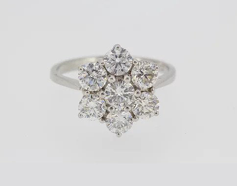 Diamond Flower Cluster Ring; featuring seven round-brilliant cut diamonds, claw set, and mounted in 18ct white gold, 2.50 carat total