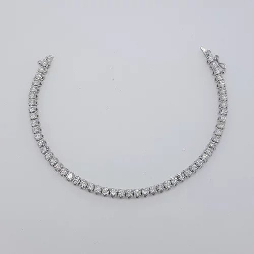Diamond Line Bracelet in 18ct White Gold; featuring 6.22 carats of round brilliant-cut diamonds, each claw-set and mounted in 18ct white gold