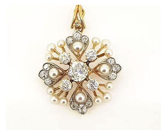 Antique Natural Pearl and Old Cut Diamond Pendant Brooch; set in a floral starburst design, 18ct gold. Central diamond approx 1.00 carat.