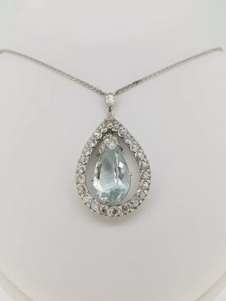Pear Cut Aquamarine and Diamond Drop Pendant; central pear cut faceted aquamarine suspended within a diamond set surround, in 18ct white gold