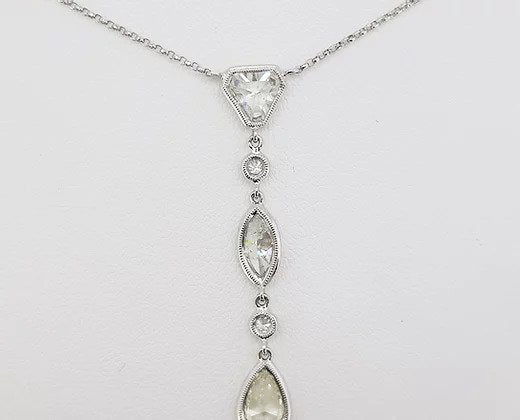 Diamond Drop Pendant, a kite, marquise and pear-cut diamond, each linked by a round brilliant-cut diamond, 2.67 carat total, 18ct white gold.