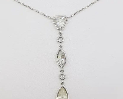 Diamond Drop Pendant, a kite, marquise and pear-cut diamond, each linked by a round brilliant-cut diamond, 2.67 carat total, 18ct white gold.