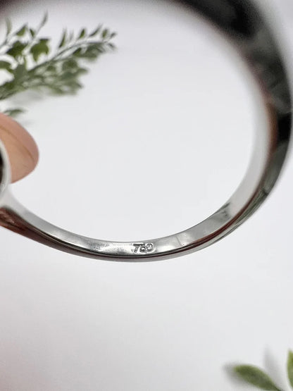 Emerald And Diamond Cluster Ring In 18 Carat White Gold