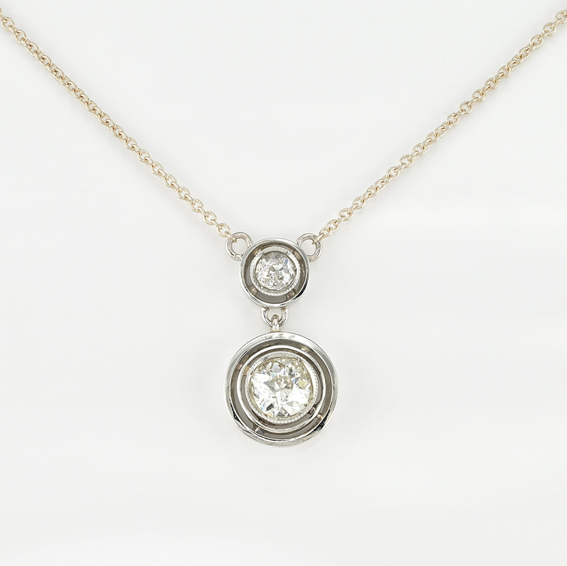Art Deco 1.15ct Twin Old Cut Diamond Solitaire Target Pendant, 0.85ct old European-cut diamond topped with 0.30ct old mine-cut diamond in 18ct white gold target settings to fixed 18ct yellow gold trace chain