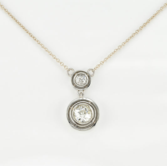 Art Deco 1.15ct Twin Old Cut Diamond Solitaire Target Pendant, 0.85ct old European-cut diamond topped with 0.30ct old mine-cut diamond in 18ct white gold target settings to fixed 18ct yellow gold trace chain