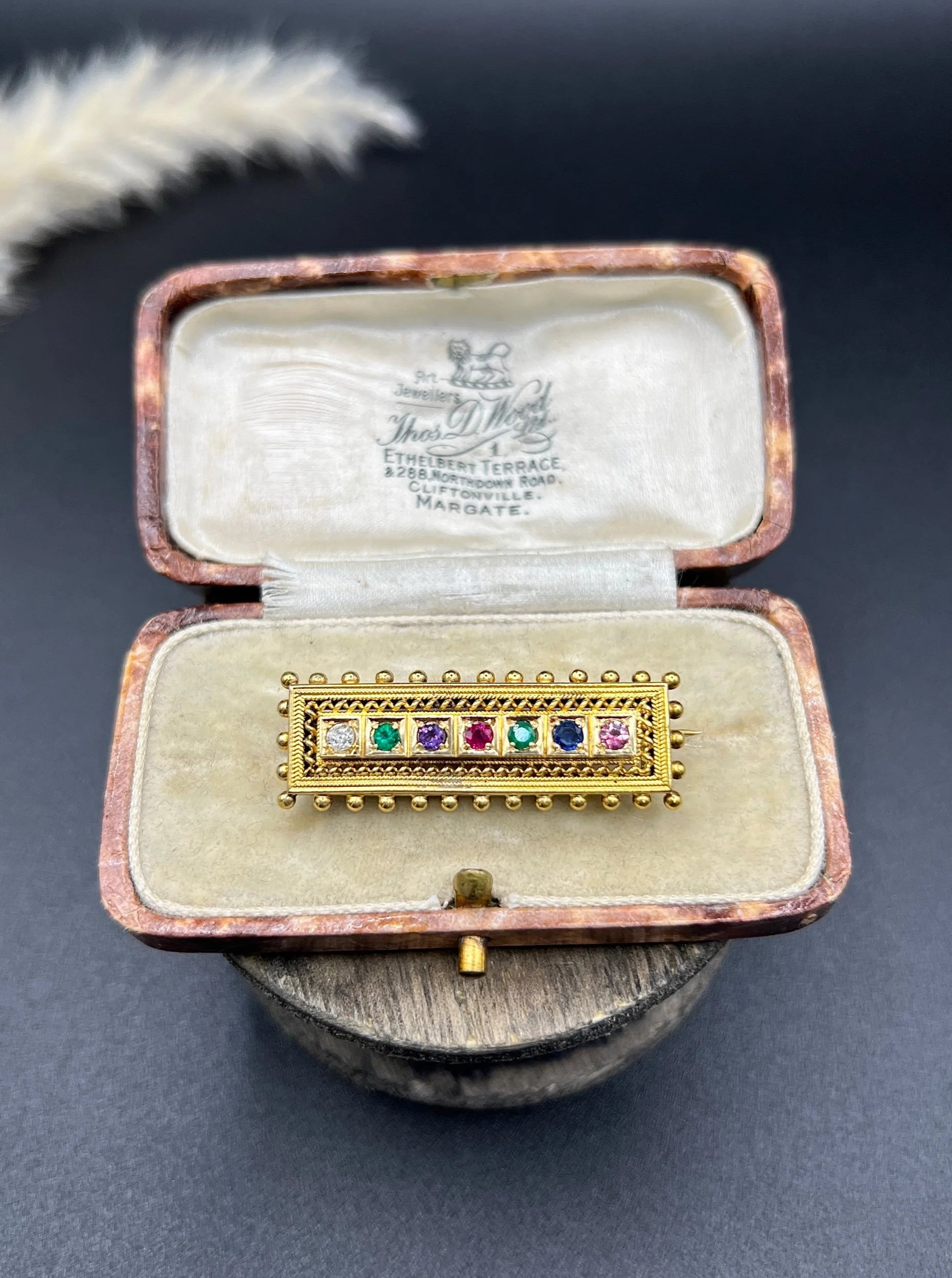 A yellow gold multi-gemstone and diamond acrostic brooch, in an antique box