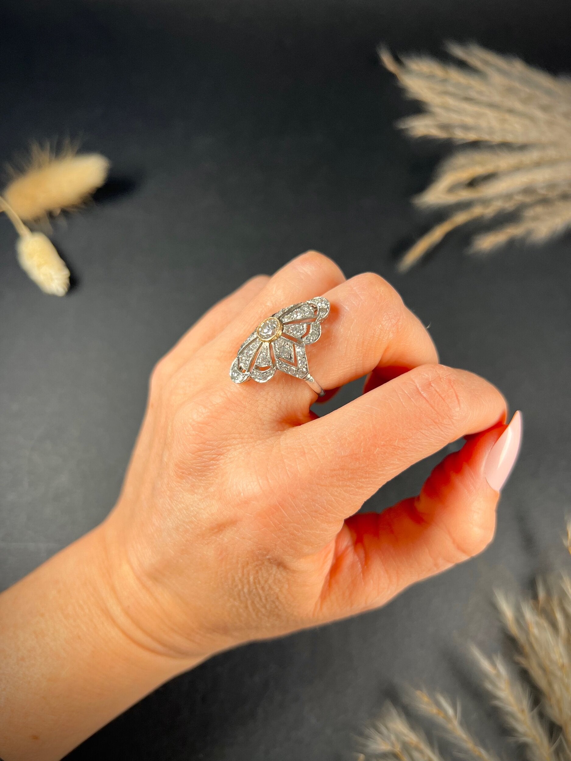 A diamond cocktail ring in white metal, modelled on a hand