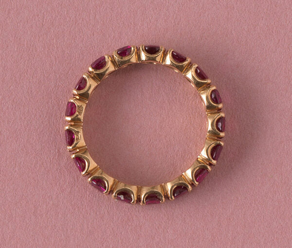French Ruby Full Eternity Ring in 18ct Yellow Gold; set with seventeen round facetted natural heated rubies, 2.89 carat total. Made in France