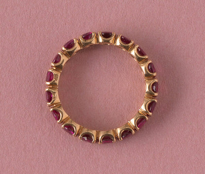 French Ruby Full Eternity Ring in 18ct Yellow Gold; set with seventeen round facetted natural heated rubies, 2.89 carat total. Made in France