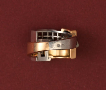 Art Deco Garnet Set Ring; geometrical construct in 18ct gold and platinum, set with 3.60cts square-cut blind-set hessonite garnets. France, Numbered 32827. 