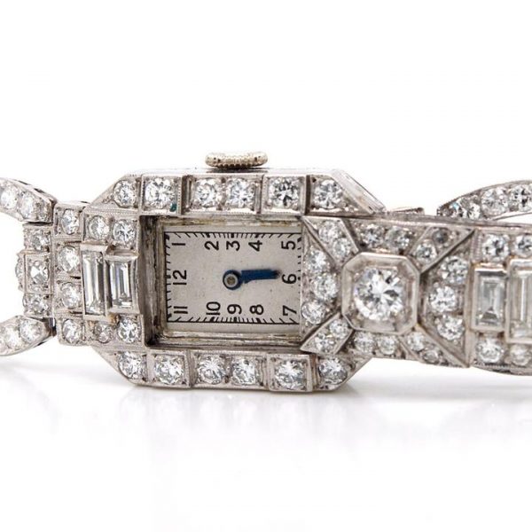 Art Deco 7ct Diamond and Platinum Bracelet Cocktail Watch; diamond bracelet with diamond set sliding panel revealing watch face, 7.00 carats, Circa 1930