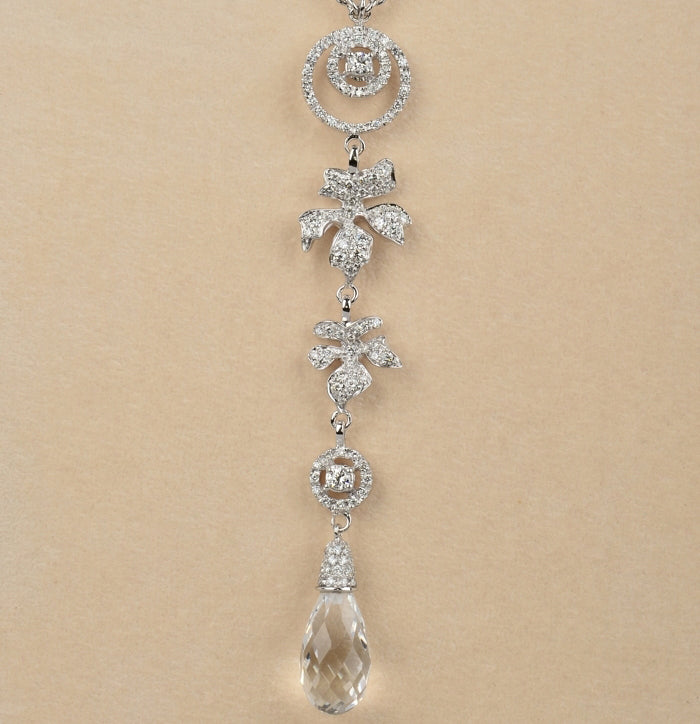 Diamond leaf pendant with faceted rock crystal drop