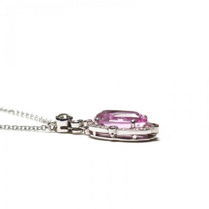 2.84ct Pink Topaz and Diamond Oval Cluster Pendant; set with a 2.84ct oval faceted pink topaz surrounded by a diamond halo, accented with pink diamonds on the quarters, and round brilliant-cut diamonds on the bale. Mounted in platinum and presented on a platinum trace chain.